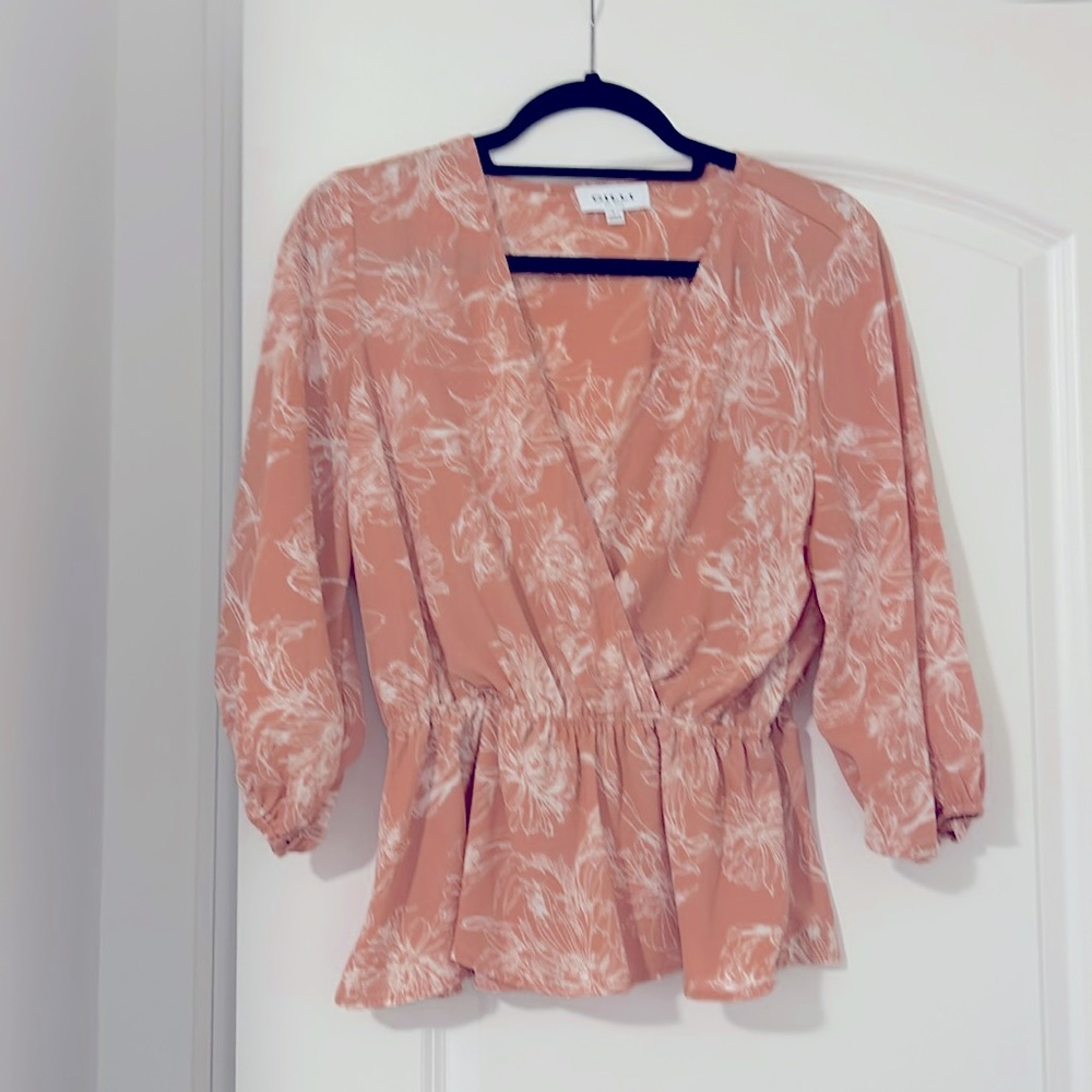 Peach colored floral peplum blouse